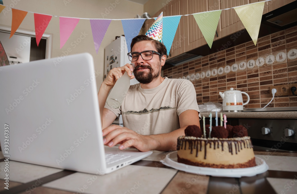 Man celebrating birthday online in quarantine time. Man celebrating birthday online in quarantine time.