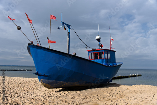 Fototapeta Naklejka Na Ścianę i Meble -  A fishing boat on the shores of the Baltic Sea