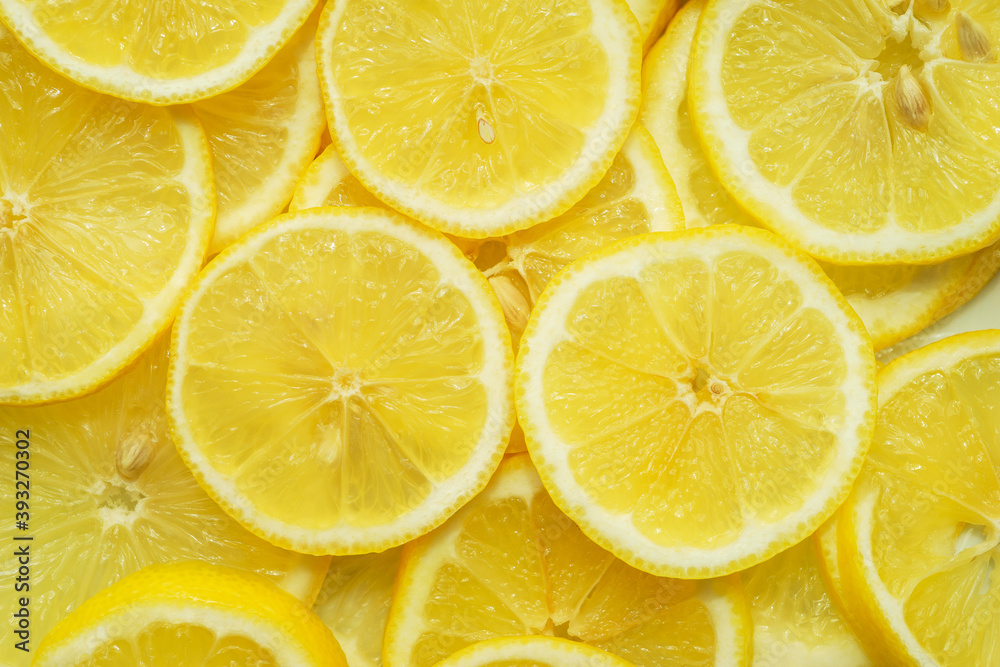 Fruit background, top view. Juicy yellow lemon cut into round slices. Fruit background, top view. Juicy yellow lemon cut into round slices.