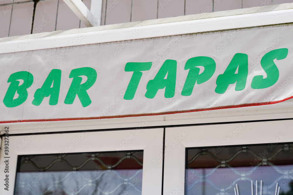 bar tapas text sign green on building city street restaurant bar tapas text sign green on building city street restaurant