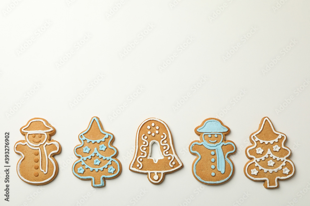 Tasty Christmas cookie on white background, space for text