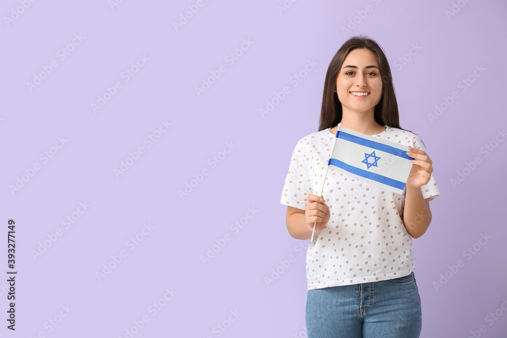 Young woman with the flag of Israel on color background Young woman with the flag of Israel on color background
