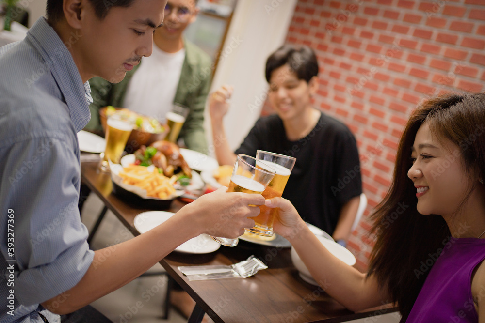 Asian friends having a party to celebrate the festival. They are drinking beer. Asian friends having a party to celebrate the festival. They are drinking beer.