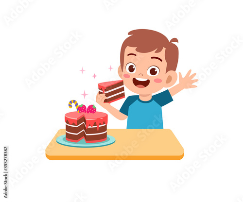 happy cute little kid boy and girl eat a birthday cake
