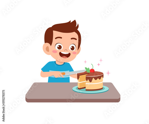 happy cute little kid boy and girl eat a birthday cake