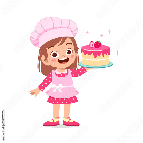 happy cute little kid boy and girl wear chef uniform and cooking a birthday cake