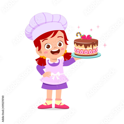 happy cute little kid boy and girl wear chef uniform and cooking a birthday cake