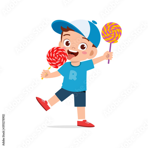 happy cute little kid boy and girl eat candy and sweets