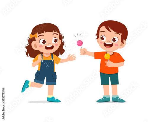 happy cute little kid boy and girl sharing food to friend