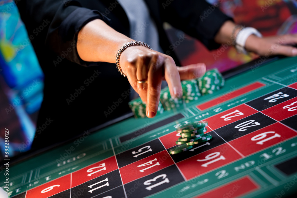 Woman playing at the roulette table Woman playing at the roulette table
