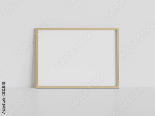 Golden frame leaning on white floor in interior mockup. Template of a picture framed on a wall 3D rendering