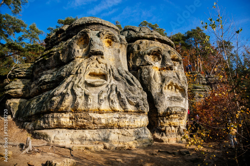 Monument sandstone rock sculptures Certovy Hlavy - Devils Heads created by Vaclav Levy between Libechov and Zelizy, Cliff carvings carved in pine forest, Czech republic