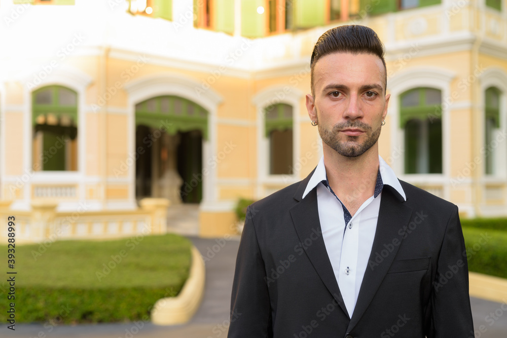 Portrait of handsome young businessman outdoors in city Portrait of handsome young businessman outdoors in city