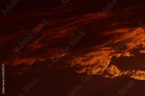 Sky cloudy orange night dramatic beautiful. Dark sunset beauty bright cloud color idyllic light nature. Outdoors red storm sun sunligh ttime weather. Clouds abstract background. 