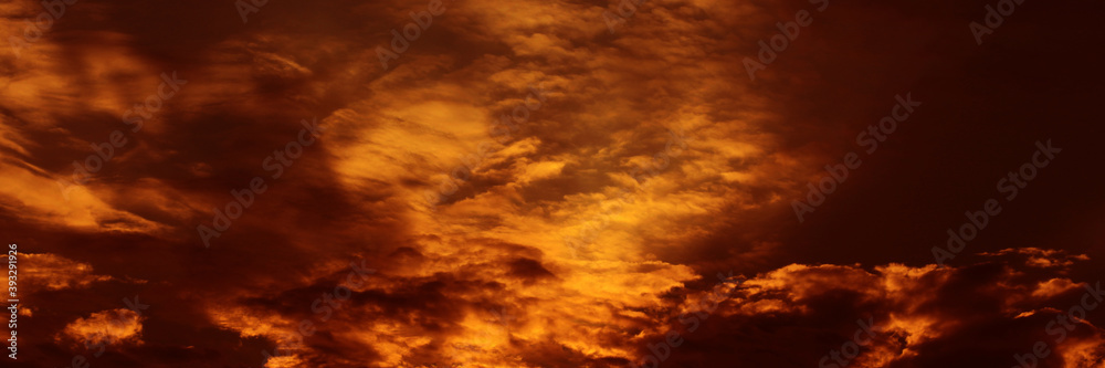 Sunset sky and sunrise orange bright abstract. Beautiful summer evening yellow clear cloud color day for wallpaper backdrop background.
