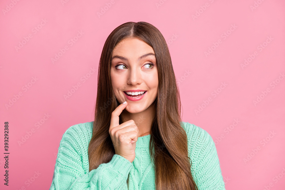 Close up photo of attractive person look empty space finger touch chin turquoise pullover isolated on pink color background Close up photo of attractive person look empty space finger touch chin turquoise pullover isolated on pink color background