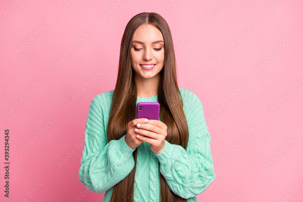 Portrait of charming person write comment hold device teal sweater outfit isolated on pink color background Portrait of charming person write comment hold device teal sweater outfit isolated on pink color background