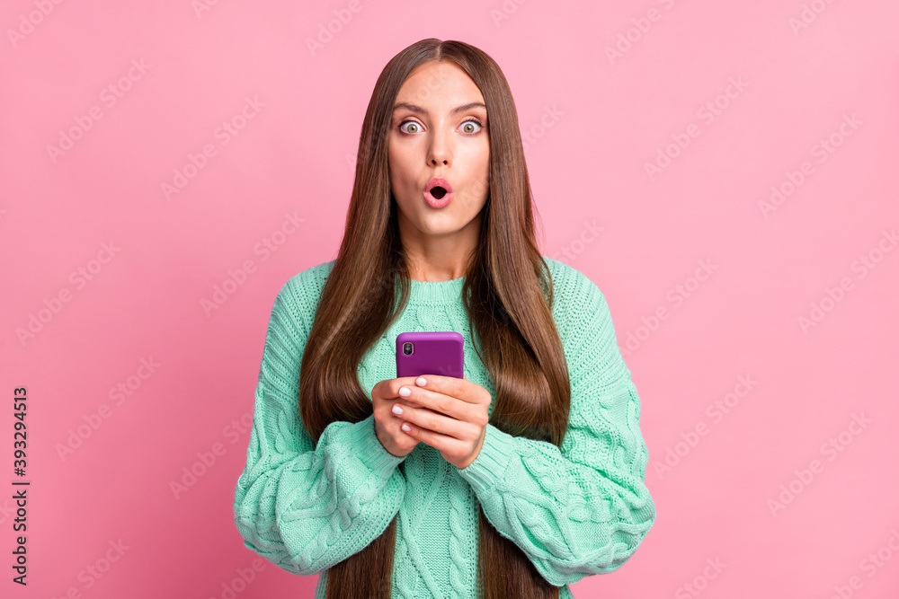 Portrait of impressed frightened person staring open mouth teal sweater isolated on pink color background Portrait of impressed frightened person staring open mouth teal sweater isolated on pink color background