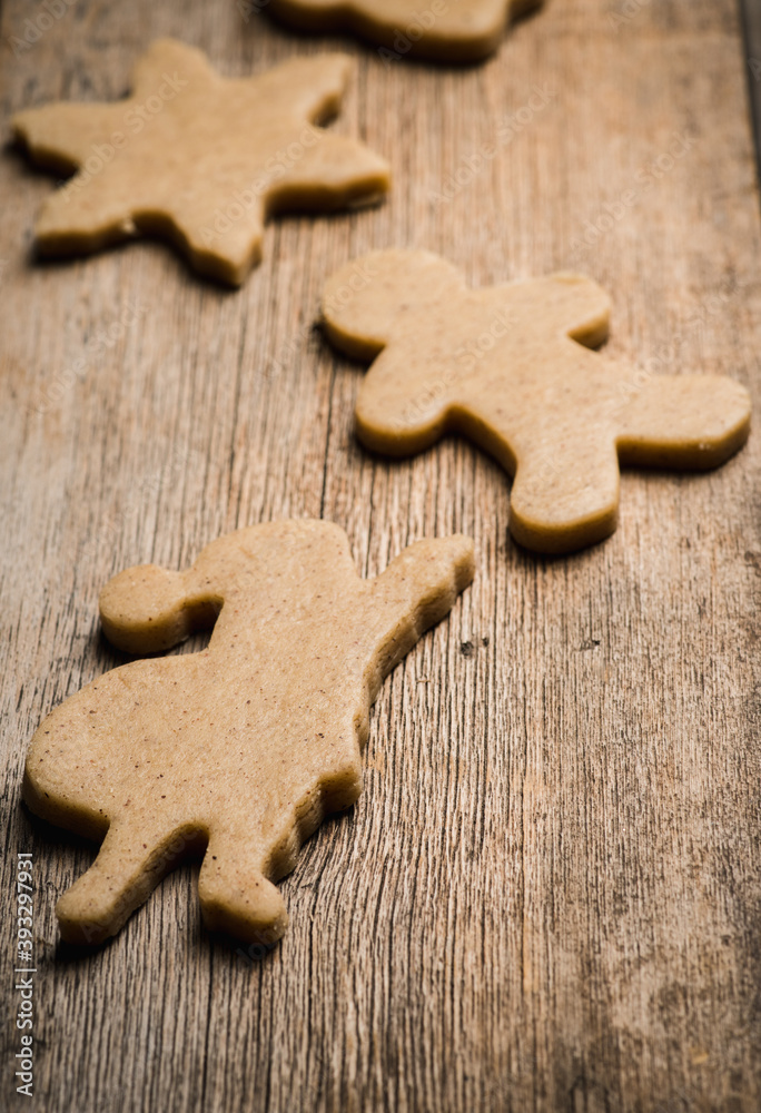 Gingerbread cookies on the wooden table before Christmas. Christmas traditions. Christmas decorations. Gingerbread cookies on the wooden table before Christmas. Christmas traditions. Christmas decorations.