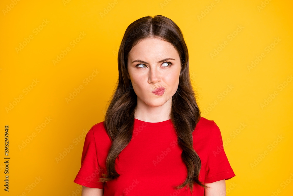 Closeup photo of pretty lady wavy hairstyle look empty space minded wear casual red t-shirt top isolated yellow color background Closeup photo of pretty lady wavy hairstyle look empty space minded wear casual red t-shirt top isolated yellow color background
