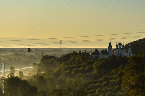 Orthodox Church at Dawn in forest photo