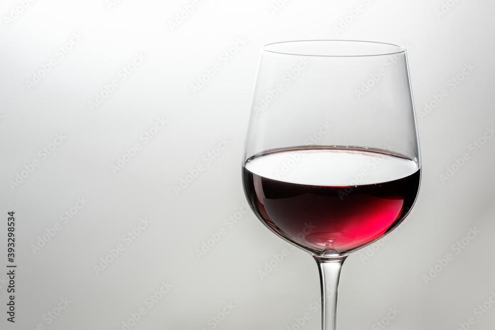 Wine glass filled with red wine closeup
