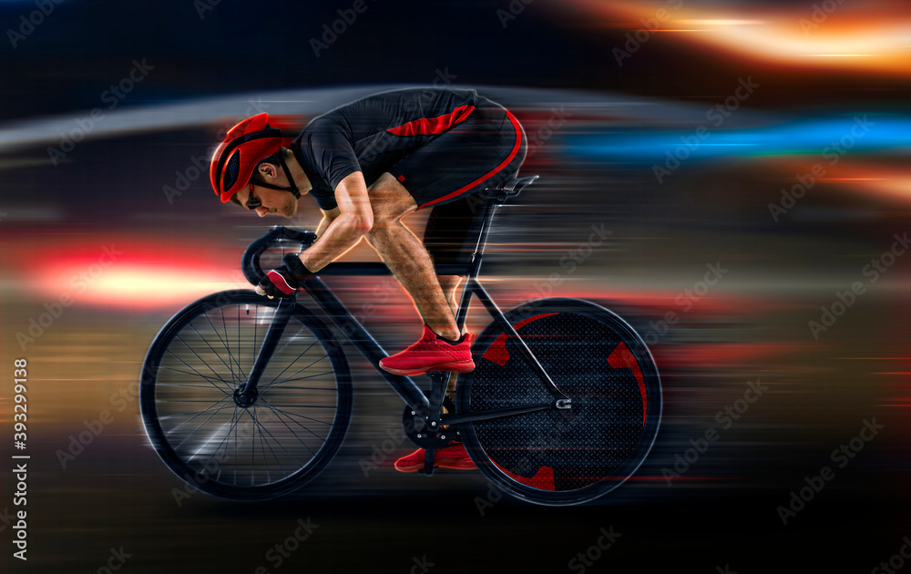 Fototapeta premium Man racing cyclist on dark background