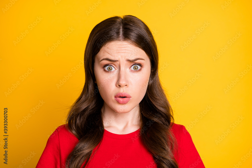 Fototapeta premium Portrait of frustrated girl horrible terrible novelty isolated over vivid color background
