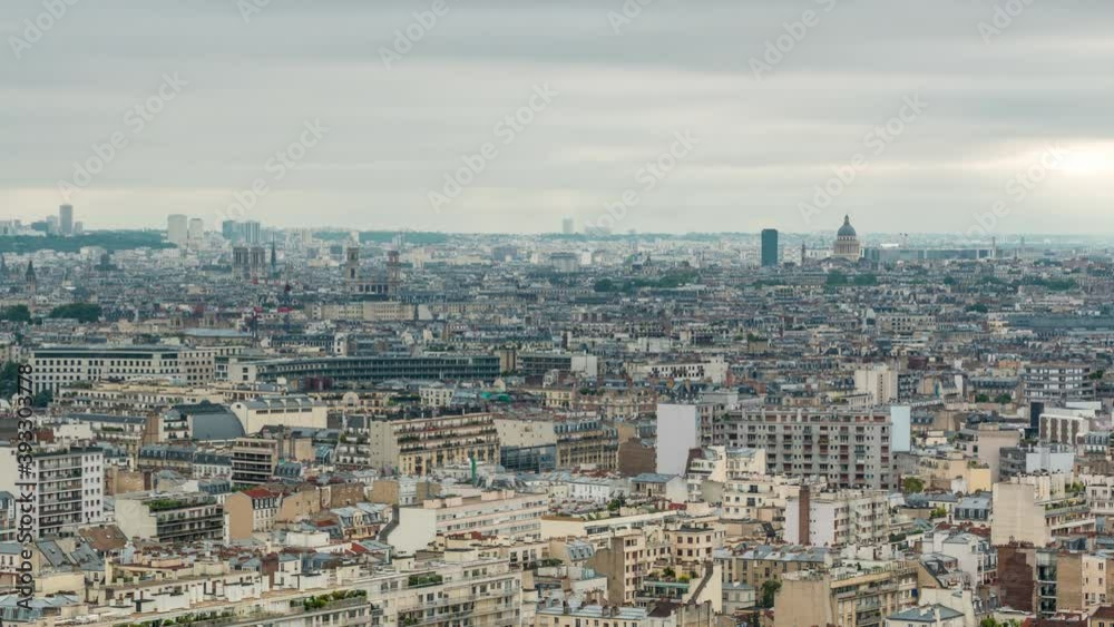 Aerial panorama above houses rooftops in a Paris timelapse. Top view with main sightseeings at the morning with cloudy sky Aerial panorama above houses rooftops in a Paris timelapse. Top view with main sightseeings at the morning with cloudy sky