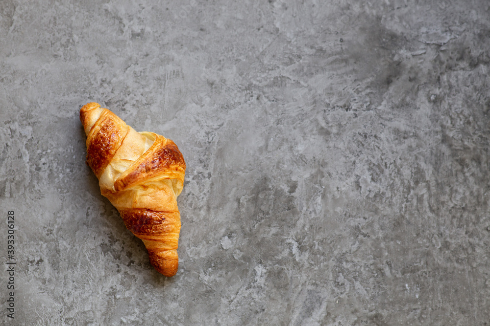Freshly baked croissants on beautiful textured concrete background Freshly baked croissants on beautiful textured concrete background