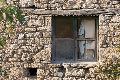 Old house and broken window with wooden lid © brahim