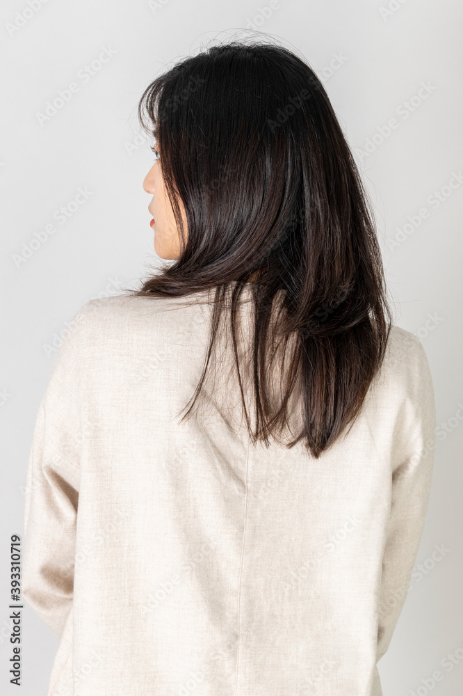 Rear view of a young woman wearing white shirt Rear view of a young woman wearing white shirt