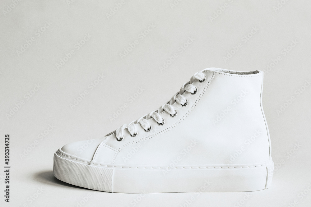 White leather high top sneakers Stock Photo | Adobe Stock