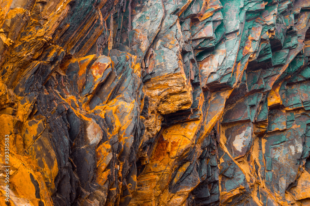 Rock layers , a colorful formation of rocks stacked over time. Interesting background a fascinating texture