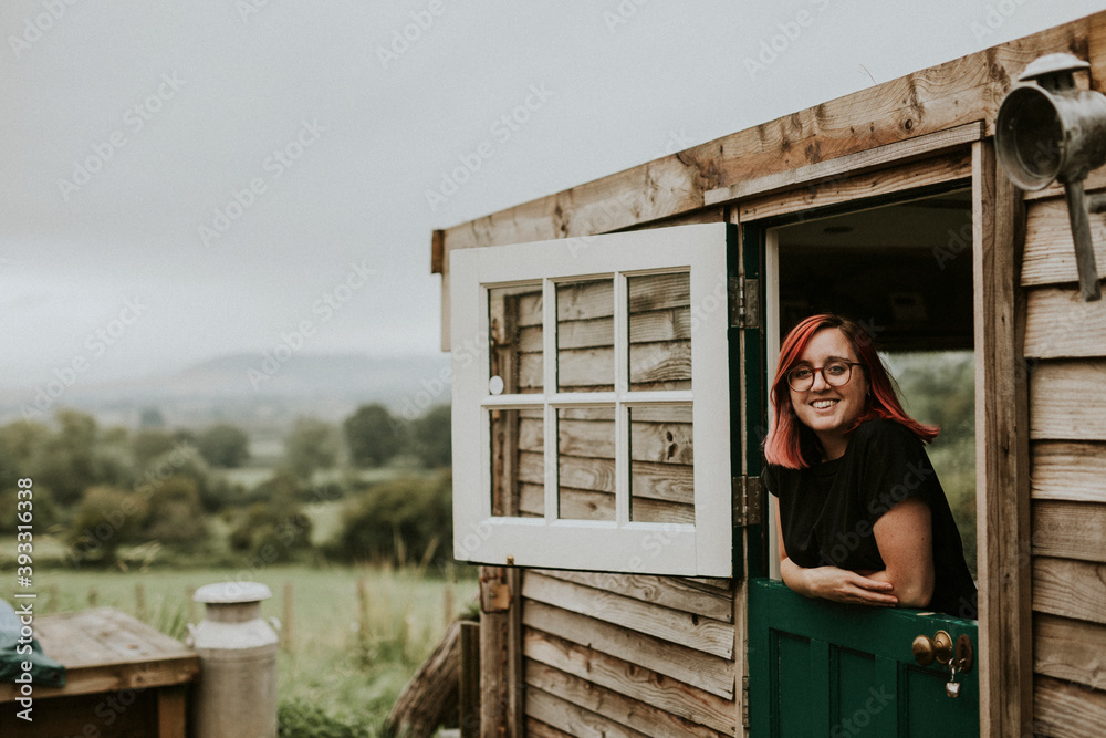 Cheerful woman in a rural wooden house Cheerful woman in a rural wooden house