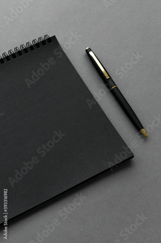 фотографія Black notebook with a pen