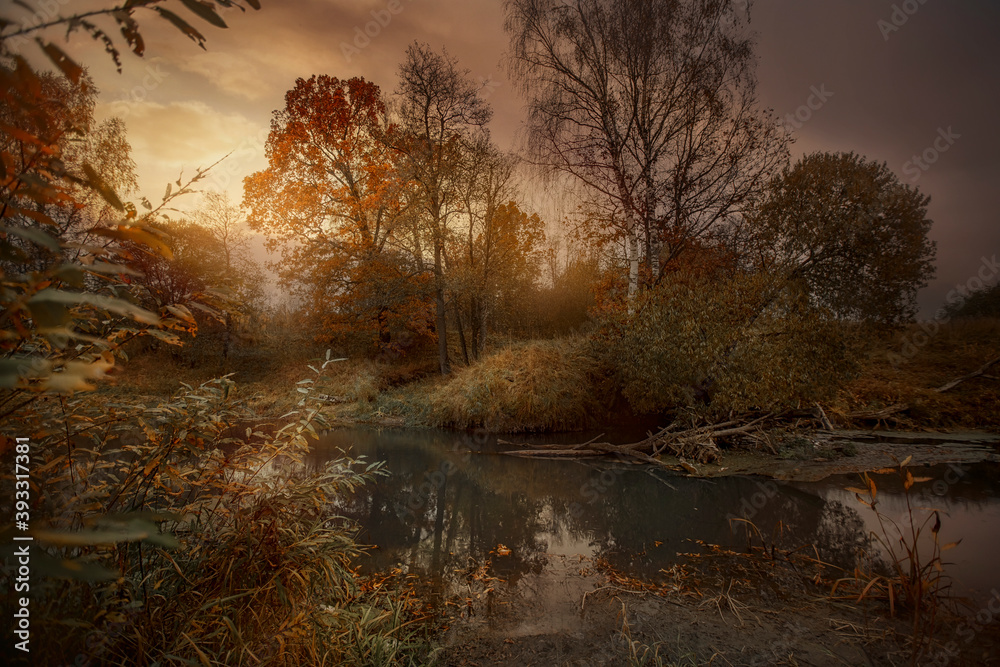 Autumn landscape with river at sunset 
