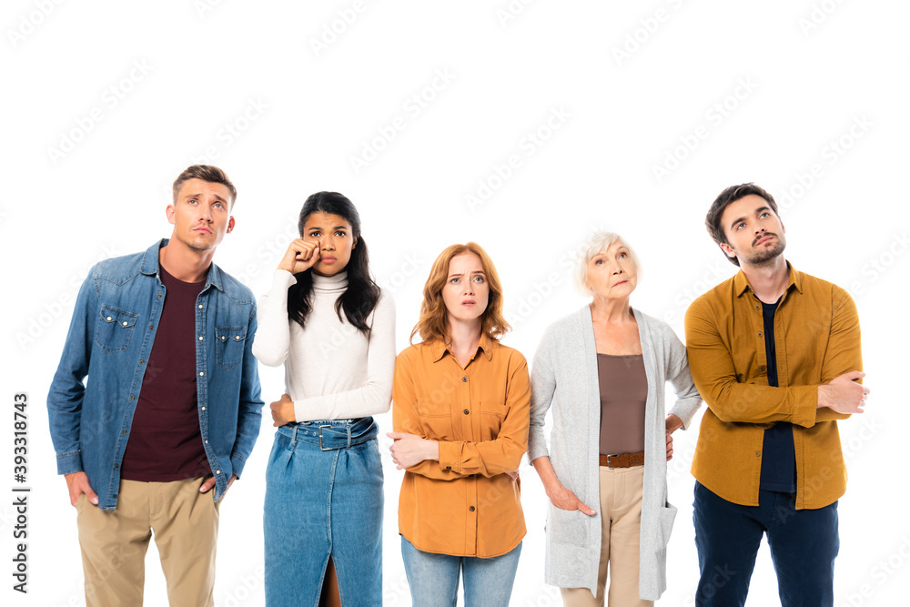 Worried multiethnic people looking away isolated on white Worried multiethnic people looking away isolated on white