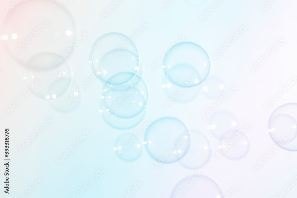 Abstract, Colorful transparent pink, blue and yellow soap bubbles floating in the air. Natural freshness summer holiday background.