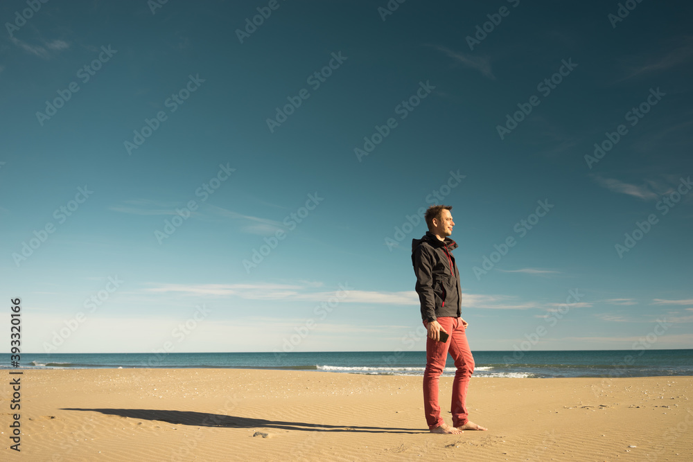 Single men on the beach winter