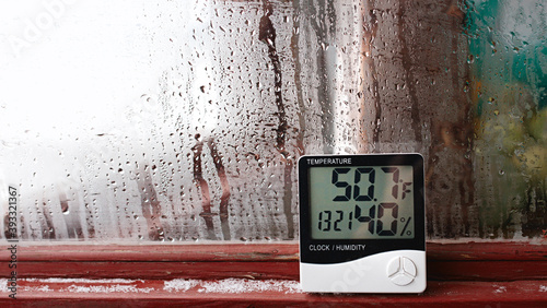 Thermometer and hygrometer of electronic to control temperature and humidity. Humidity indicator is indicated on the hygrometer of the device photo