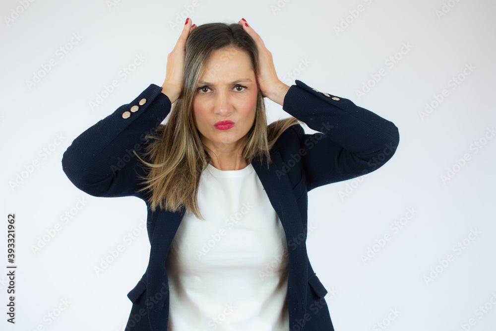 Portrait of caucasian business woman touching her head and expressing worry isolated over white background Portrait of caucasian business woman touching her head and expressing worry isolated over white background