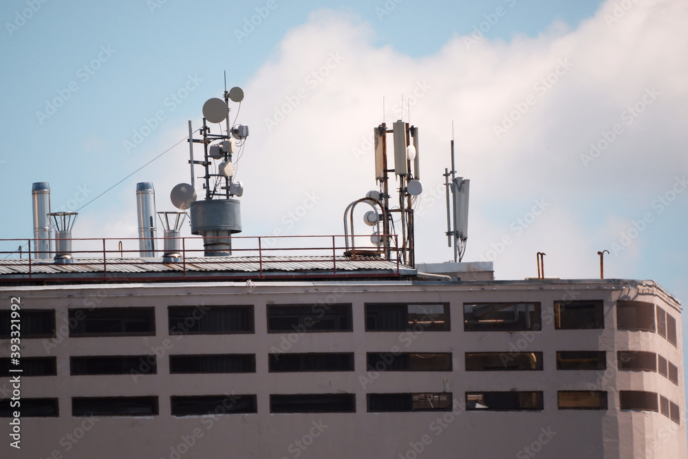Mobile communication antennas on the roof of the building.