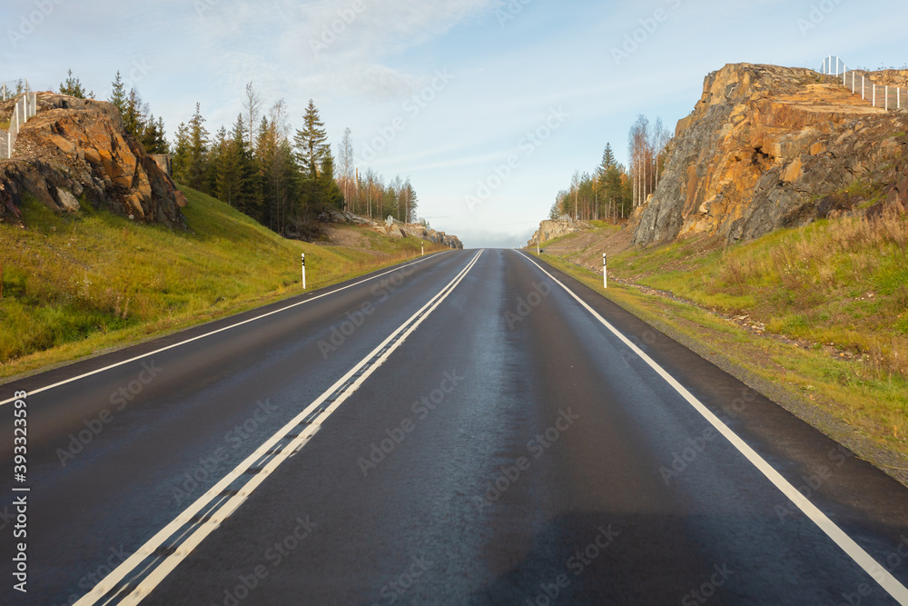 Nice track without cars. in Finland. Good visibility on the road. Autumn day. Nice track without cars. in Finland. Good visibility on the road. Autumn day.
