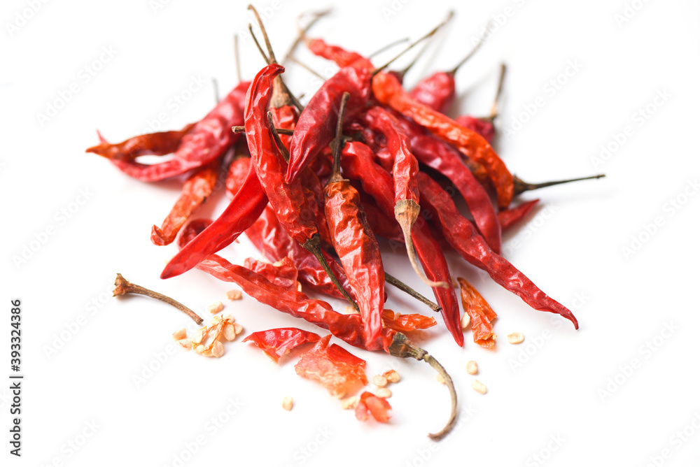 Dried chili on white background - pile of red dried chilli pepper cayenne Dried chili on white background - pile of red dried chilli pepper cayenne