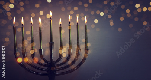 Religion image of jewish holiday Hanukkah background with menorah (traditional candelabra) and candles photo