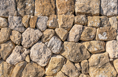 Wall made with stones and without cement, typical of the rural areas of the island of Mallorca photo