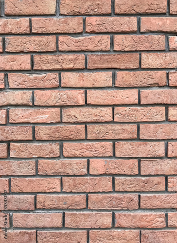 Red brick wall texture, template for wallpaper background closeup view 