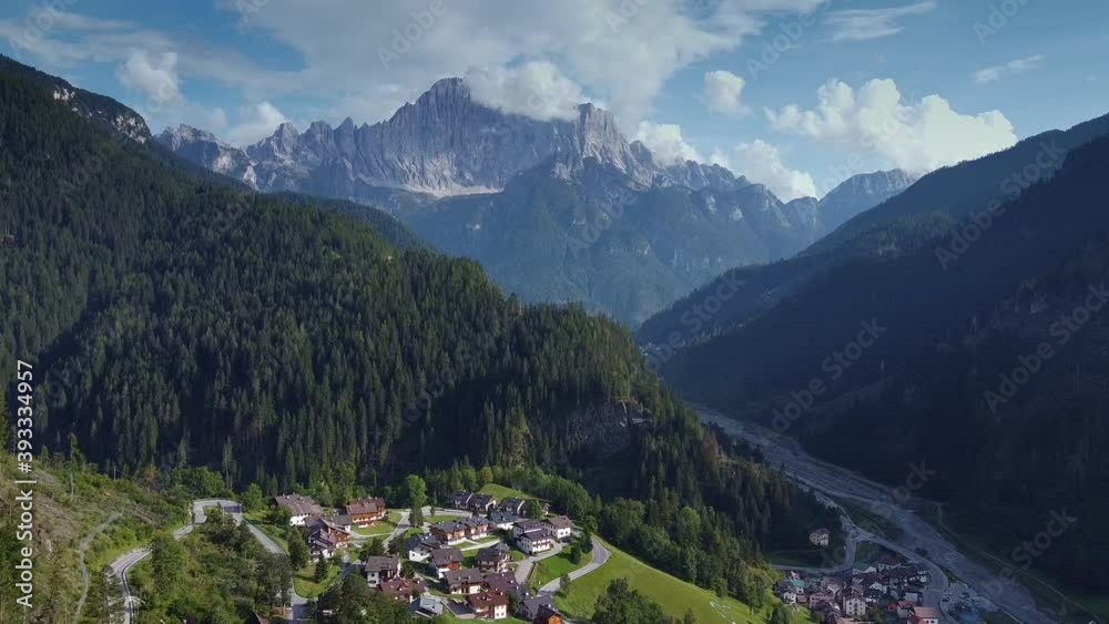 Fantastic aerial view of Dolomites in Italian Alps. There is a village in the valley. Fantastic aerial view of Dolomites in Italian Alps. There is a village in the valley.
