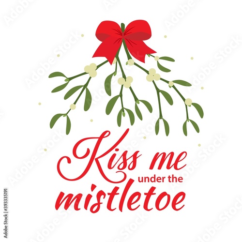 Vector Christmas typography card Kiss Me Under the Mistletoe isolated on white background. Hand lettering with traditional season plant and funny quotation. Xmas quote and decoration.